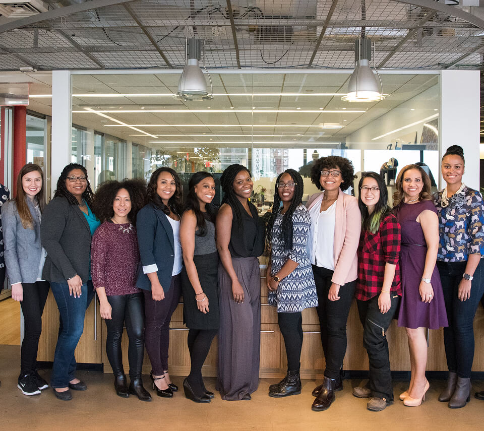 group-women-standing-near-desk-photo