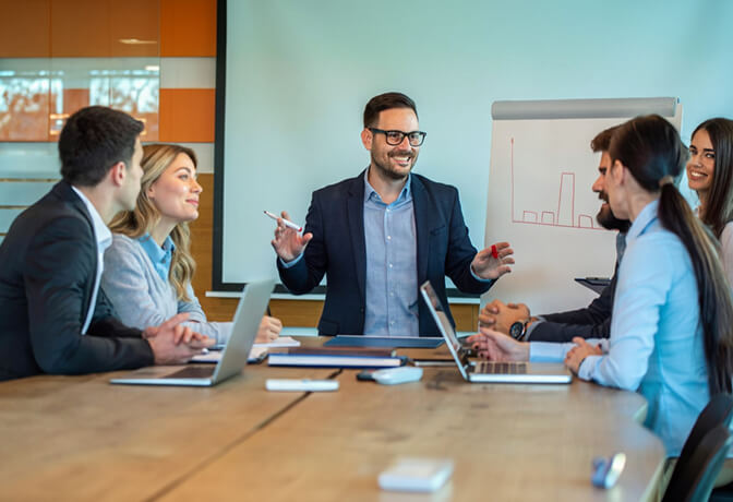 Office Members in metting with smilling faces