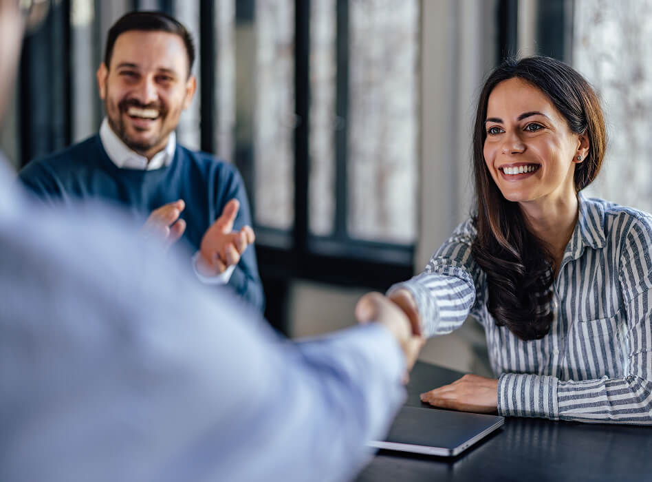 successful-businesswoman-being-congratulated-image